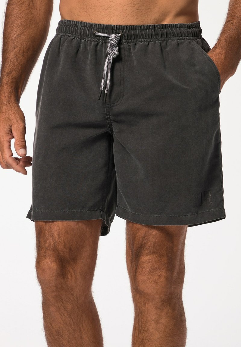 Zwarte shorts van zacht stof, met een elastische tailleband met trekkoord, zijzakken en een gezoomde manchetten.