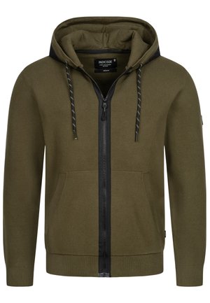 Olivengrøn zip-up hættetrøje med sorte accenter, snore og kengurulommer. Lavet af ribbet materiale med struktureret stof.