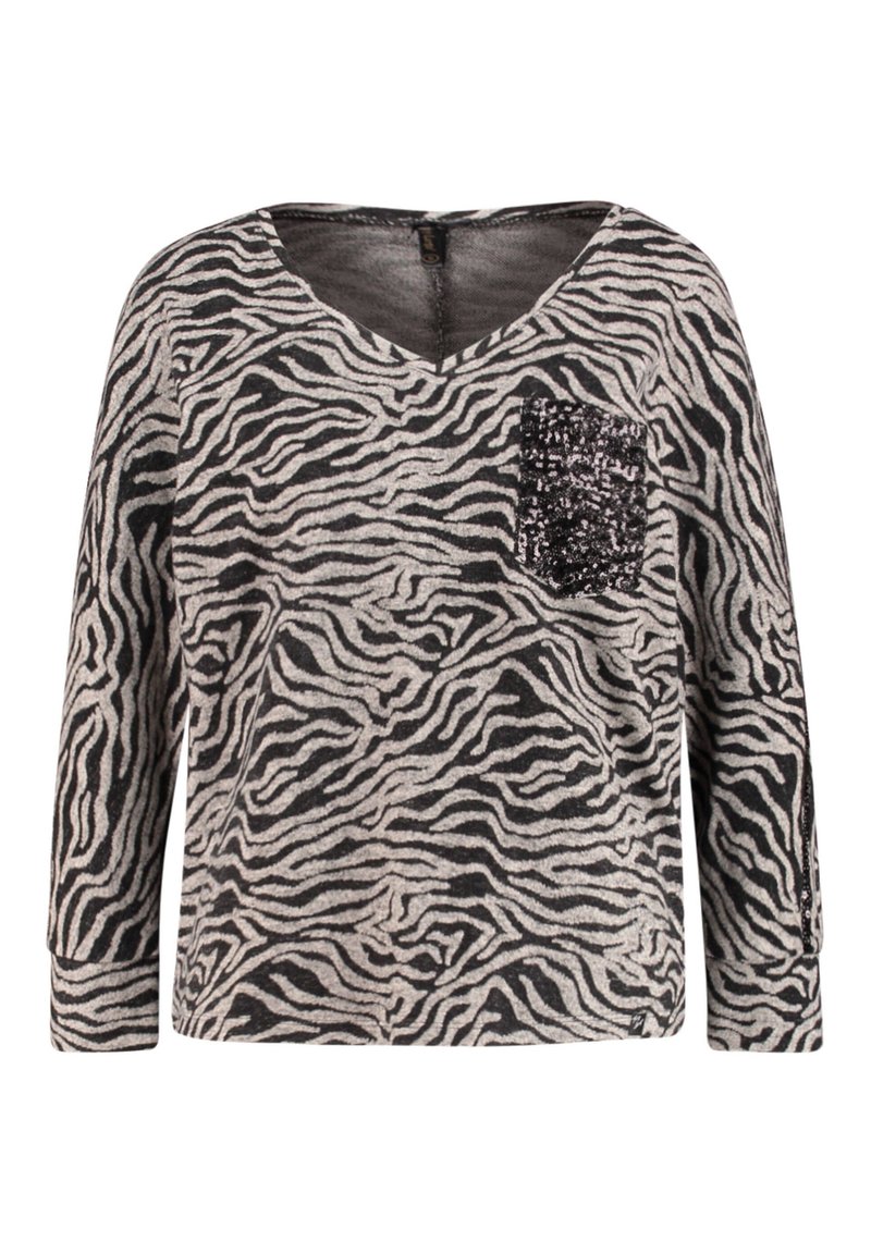 Czarny i szary top w paski zebry z długimi rękawami, dekoltem w serek i detalem z cekinowej kieszonki po lewej stronie. Miękka tkanina o luźnym kroju.