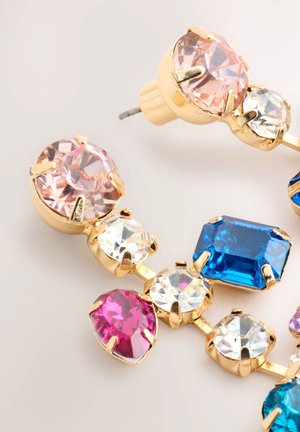 Gold-tone earrings featuring an arrangement of multi-colored gemstones: pink, blue, and clear, with various cut shapes and polished finishes.