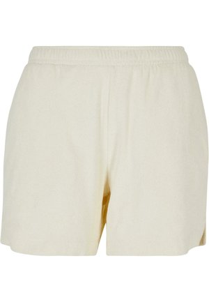 Cream-colored, soft fabric shorts with an elastic waistband, straight cut, and side seams. Features minimal design and no visible hardware.
