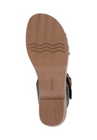 Black sandal with a textured rubber sole, featuring adjustable straps and a comfortable footbed. Size 37 marked on the underside.