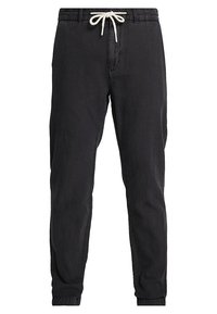 Zwarte katoenen joggingsbroeken met een trekkoord in de taille, met een fijne pasvorm en omgeslagen boorden. Gladde textuur zonder zichtbare patronen of accentueringen.