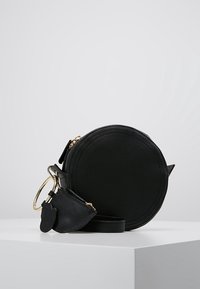 mint&berry Axelremsväska - black