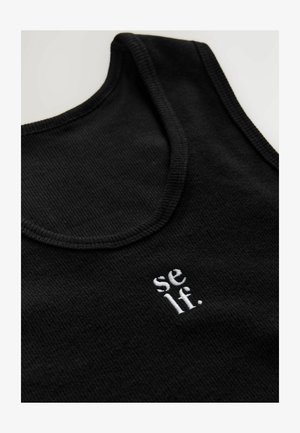 Black cotton tank top with a ribbed texture. Features a round neckline and white embroidered text reading "se lf." near the bottom.