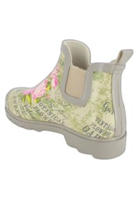 Bottine en caoutchouc à motif floral, dans des teintes de vert clair et beige, dotée d'un panneau latéral élastique et d'une semelle texturée. Détails de impressions décoratives présents.