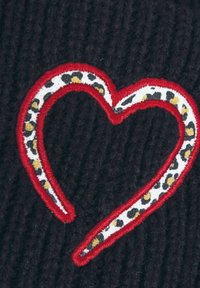 Black knitted fabric featuring a red embroidered heart outline with a white and leopard print inner detail. Textured appearance.