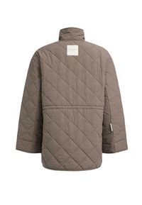 Quilted jacket in muted brown with a high collar and oversized fit. Features a square logo patch on the back and subtle stitching details.