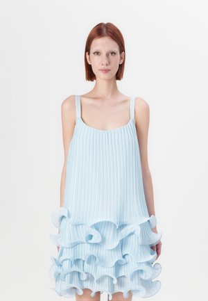 Light blue pleated dress with thin straps and a ruffled hem. The fabric is lightweight with a smooth texture, featuring layered design details.