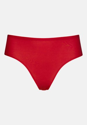 Punainen mikrokuituinen bikinitrikoo, jossa on saumaamaton muotoilu ja sileä, pehmeä tekstuuri. Minimalistinen muoto alhaalla olevalla vyötärönauhalla.