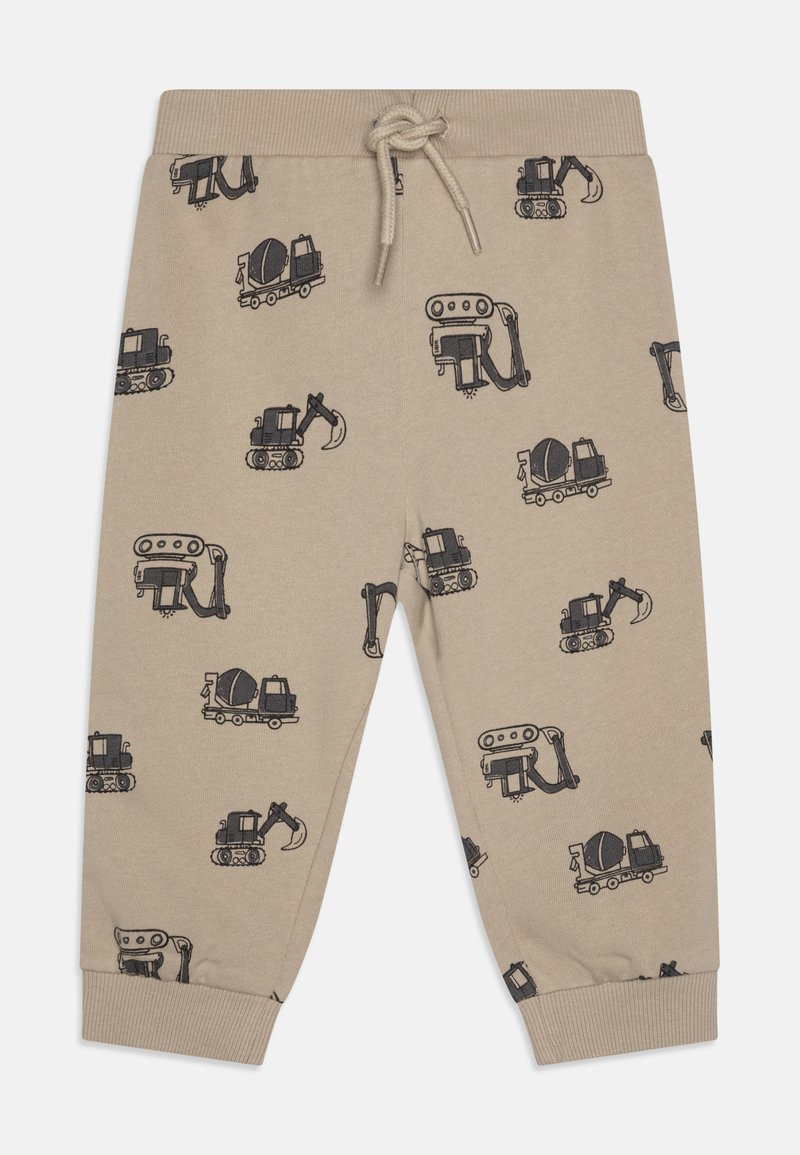 Beige sweatpants featuring a repeated print of construction vehicles in black. Elastic waistband with drawstring; cuffed ankles. Soft fabric.