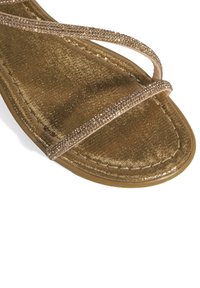Desa Riemensandalette - gold-coloured