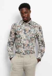 Long-sleeve button-up shirt featuring a colorful, intricate floral and paisley pattern on a light background; smooth fabric.