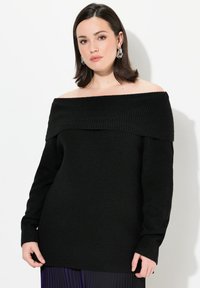 Schwarzer, schulterfreier, gerippter Pullover mit langen Ärmeln und lockerer Passform. Strukturiertem Stoff mit weiter Halslinie, ideal zum Schichten.