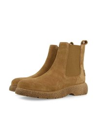 Bottines en daim couleur tan avec des panneaux latéraux en élastique, une semelle en caoutchouc texturé marron et des languettes à l'arrière pour un enfilage facile.