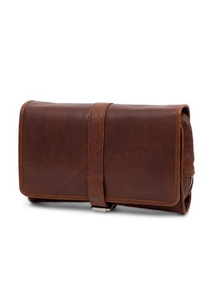 Brown leather travel pouch with a textured finish, flap closure secured by a strap, and metallic zipper detail along the side.