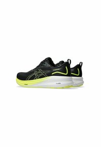 Black athletic shoes with yellow accents, featuring a cushioned sole and sleek design, positioned side by side against a white background.