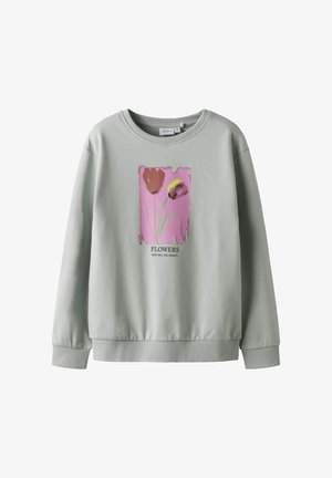 Světle šedá mikina vyrobená z bavlny, zdobená květinovým potiskem v růžové, červené a žluté barvě. Hladký vroubkovaný výstřih a manžety, uvolněný střih.