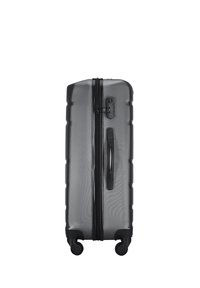 Black hard-shell suitcase with textured surface, dual zippers, side handle, and four rotating wheels for easy mobility.