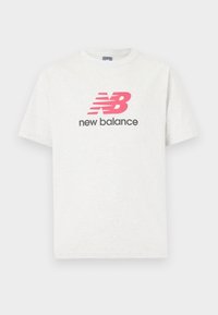White short-sleeve t-shirt made of cotton, featuring a prominent pink "NB" logo with red stripes and black "new balance" text underneath.