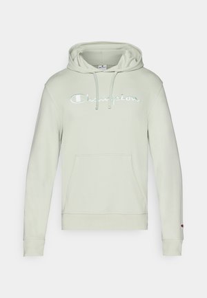 Hoodie vert clair avec une poche kangourou à l'avant, capuche avec cordon de serrage et logo "Champion" brodé. Fabriqué en tissu doux, il présente des poignets côtelés.