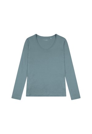 Top a maniche lunghe e collo a V in un morbido colore teal tenue. Realizzato in un tessuto liscio con una vestibilità leggermente ampia, presenta dettagli minimi.