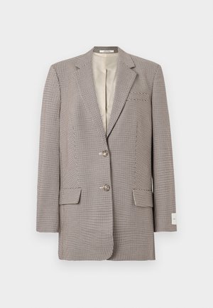 Blazer simple boutonné avec un motif pied-de-poule noir et blanc, deux boutons, revers crantés, poches à rabat et doublure intérieure beige.