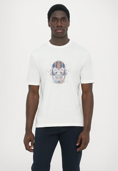 T-shirt en coton blanc avec un graphique de crâne coloré centré sur la poitrine. Manches courtes, col rond et coupe décontractée.
