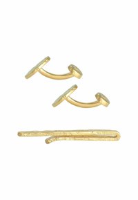 Gold-tone metal cufflinks with circular embossed design and curved backs, paired with a textured gold-tone hairpin.