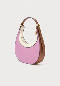 Curved leather handbag with pink front, white zipper trim, brown sides, adjustable brown strap, and gold hardware, standing on white background.