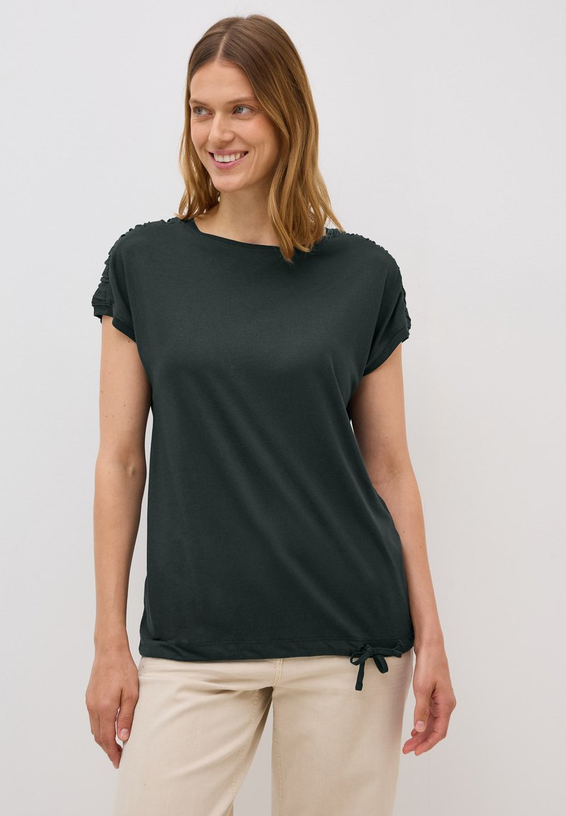 Mørkegrøn T-shirt med korte rulleærmer, blødt stof, afslappet pasform og en gathered snor i kanten for justerbar længde.