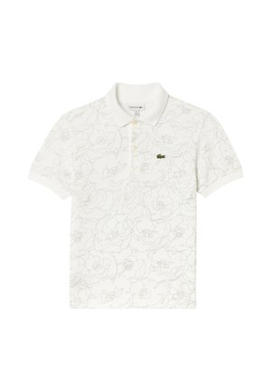 Hvid poloshirt med korte ærmer, diskret blomsterbroderi, tre knapper og et lille grønt krokodillelogo på venstre bryst.