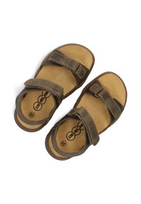 Bruine lederen sandalen met twee verstelbare banden, een gevoerde voetbed en een bruine rubberen buitenzool. Heeft een logo op de binnenzool.