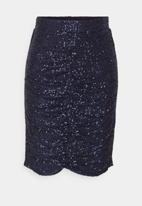 Jupe en sequins bleu marine avec une taille côtelée, présentant une silhouette ajustée et un ourlet en forme de vagues, réfléchissant la lumière grâce à ses sequins texturés.