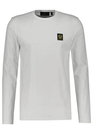 T-shirt blanc à manches longues avec col rond et petit logo carré noir et or sur le côté gauche de la poitrine.