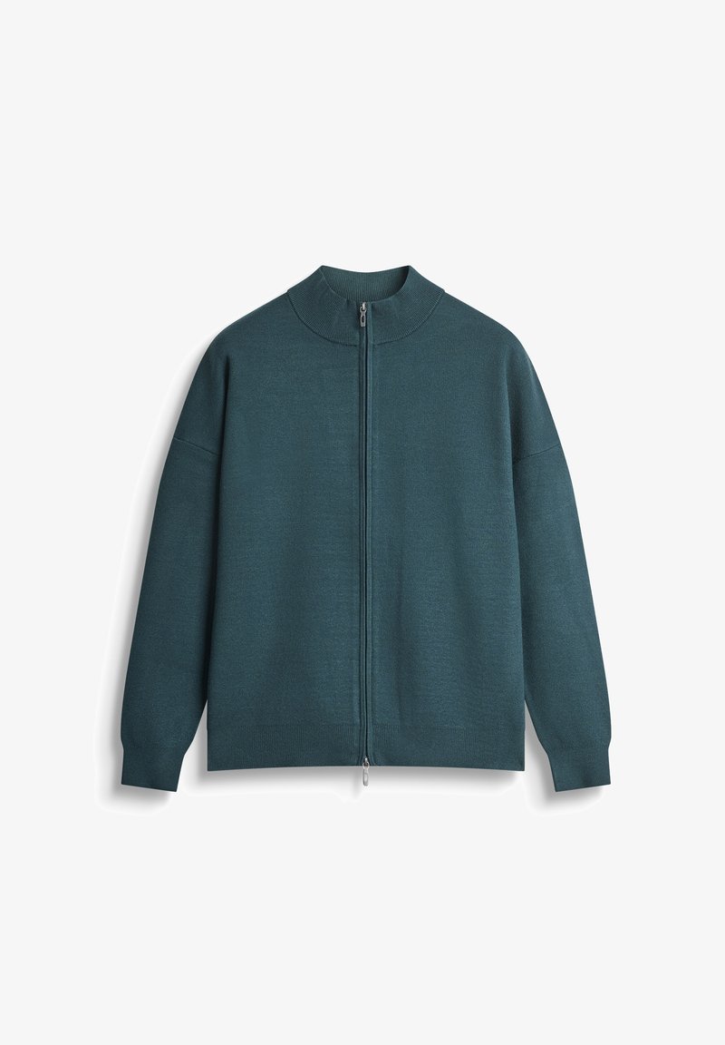Maglione zip-up in teal con colletto alto, vestibilità rilassata e polsini a costine. Realizzato in materiale morbido, con zip centrale.