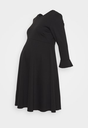 Black long-sleeve maternity dress with flared skirt and slight ruffle detail at the sleeve cuffs, shown on a plain background.