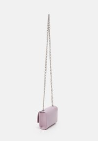 Light purple rectangular handbag with a smooth texture, silver chain strap, and stitched edges, worn as a crossbody or shoulder bag.