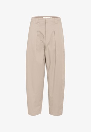 Beige, cotton blend trousers with a loose fit, featuring front pleats, a waistband, and cropped ankles. Simple design, no patterns or accents.