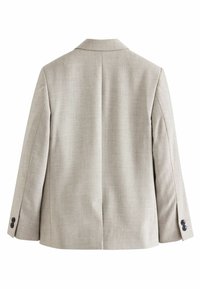 Ljusbeige blazer med klassisk slag, strukturerad silhuett, en bakre slits och knäppte ärmslut. Tillverkad av texturerad tyg.