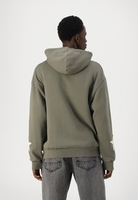 YOURTURN UNISEX - Jaka ar rāvējslēdzēju - khaki