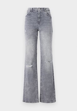 Høyt livd grå denimjeans med slengbein, med utvaskede knedetaljer, klassisk fem-lomme-design og tonet søm.