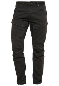 Svarta cargobyxor med slim fit, med flera sidofickor, avsmalnande ben och knäppning fram. Tillverkade av slitstarkt tyg.