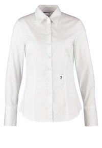 Camisa blanca de manga larga con botones, cuello puntiagudo y un pequeño bordado de una rosa negra cerca de la cintura en el lado derecho.