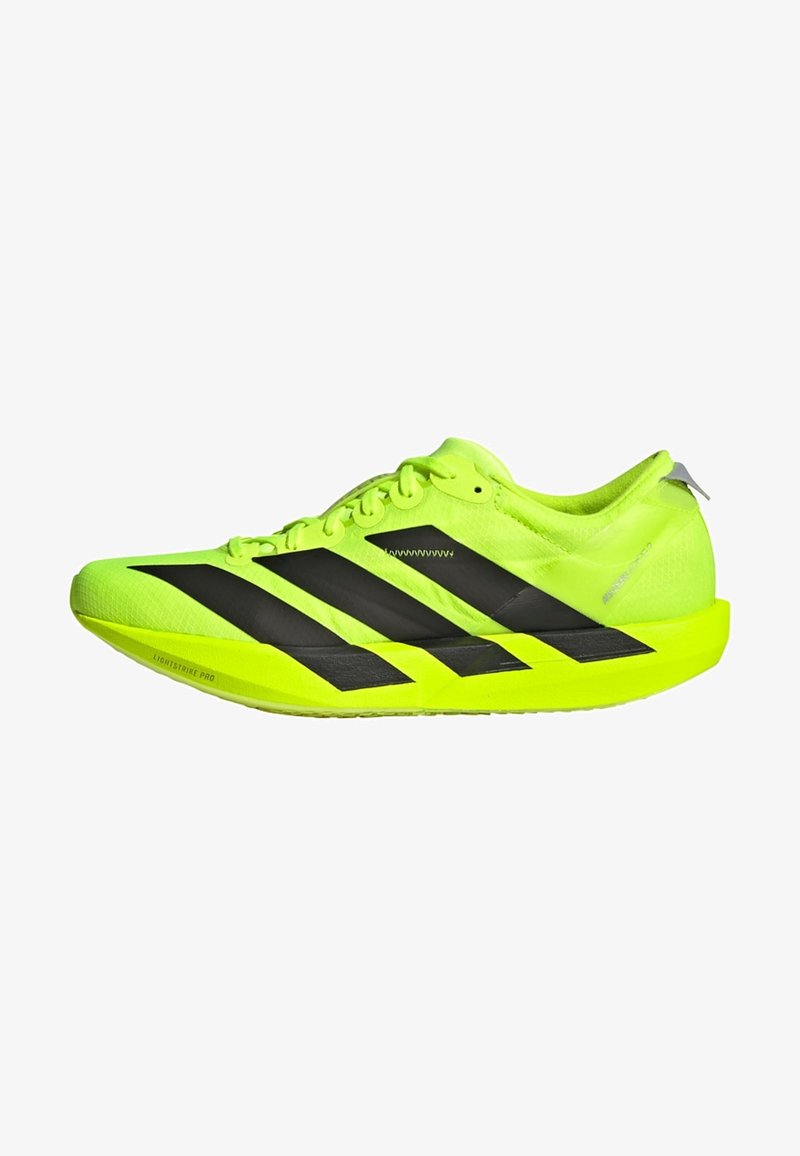 Lime green running shoe featuring three black stripes, lightweight mesh upper, textured sole, and reflective details on heel.
