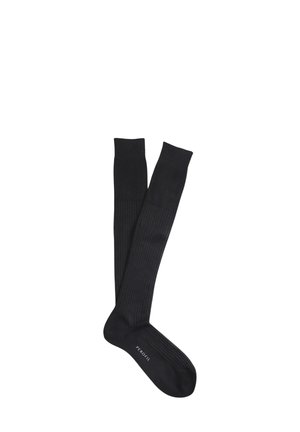 Calze nere fino al ginocchio realizzate in tessuto morbido, con un design a costine nella parte superiore e una sezione del piede uniforme, con il marchio sulla suola.