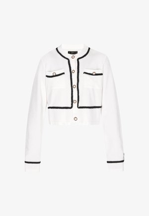 White cropped cardigan with long sleeves, black trim, two front pockets, and gold-tone buttons. Knitted texture with contrast detailing.