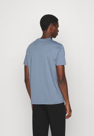 Emporio Armani T-shirt estampada - fumo di londra