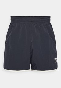 Námořnické modré šortky s elastickým pasem, které mají kontrastní bílý lem na spodním okraji a malé logo na levém dolním předním městě.