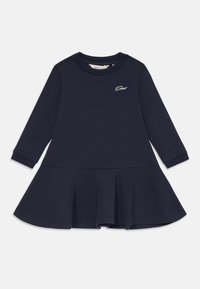 Marineblauwe lange mouwen peuterjurk met een uitlopende rok en klein geborduurd "Gant" logo op de linkerkant van de borst.